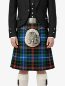Person wearing a traditional Scottish kilt with a tartan pattern on a white background