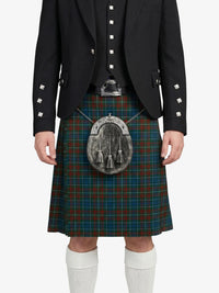 Person wearing a black jacket and tartan kilt with a sporran on a white background