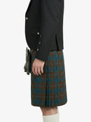 Person wearing a black jacket and a plaid kilt on a white background