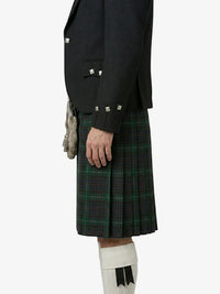 Person wearing a black jacket and green plaid kilt on a white background