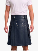 A person wearing a dark navy pleated faux-leather kilt with silver-tone double-breasted buttons and side flap pockets, paired with a white t-shirt against a light gray background.