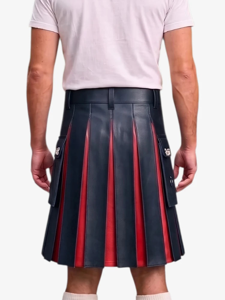A person shown from the back wearing a pleated leather kilt with alternating dark navy and red vertical pleats, paired with a light pink t-shirt and white socks, against a plain light gray background.