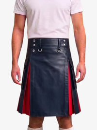 A person wearing a black faux-leather kilt with red side panels and silver metal hardware, paired with a light pink t-shirt against a plain light gray background.
