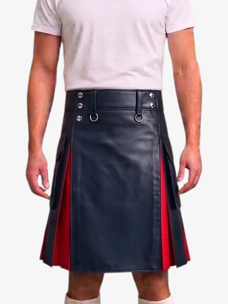 A person wearing a black faux-leather kilt with red side panels and silver metal hardware, paired with a light pink t-shirt against a plain light gray background.