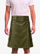 A man wearing an olive green faux-leather kilt with silver-tone metal hardware and side cargo pockets, paired with a light pink t-shirt and white socks, against a plain white background.