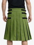 Olive Green pleated skirt with black straps worn by a person on a white background