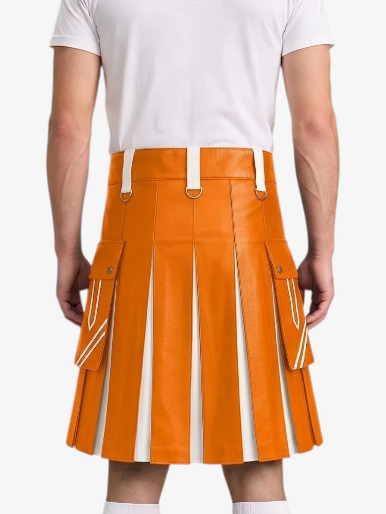 An orange faux-leather pleated kilt with white contrast stitching and white belt loops, shown on a model from the back wearing a white t-shirt.