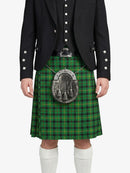 Person wearing a green plaid kilt with a black jacket on a white background