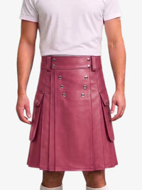 A person wearing a dusty rose faux leather kilt with silver-tone metal buttons and side flap pockets, paired with a white t-shirt against a light gray background.