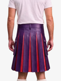 A person shown from the back wearing a purple pleated leather kilt with red vertical stripe accents and side flap pockets, paired with a white t-shirt and white socks, against a light gray studio background.