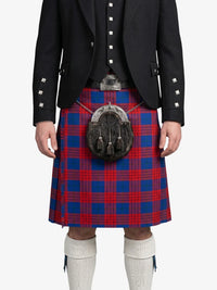 Person wearing a black jacket and red and blue plaid kilt on a white background