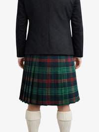 Person wearing a black coat and green plaid kilt on a white background