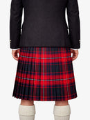 Person wearing a black jacket and red plaid kilt on a white background