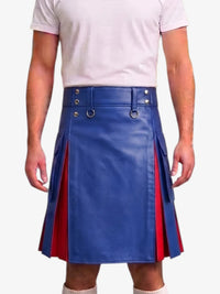 A person wearing a blue faux-leather kilt with red side panels and silver metal hardware, paired with a light pink t-shirt against a plain white background.