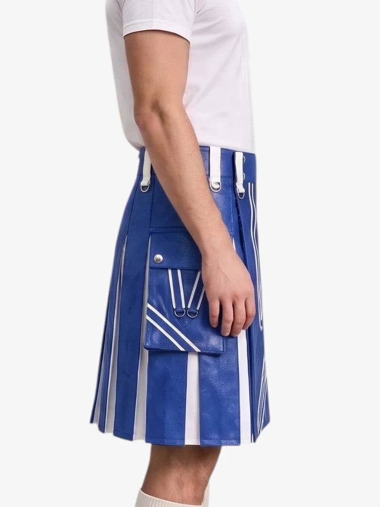 A person wearing a blue pleated leather kilt with white vertical stripes, diagonal stripe details, and a large front flap pocket with silver-tone hardware, paired with a white t-shirt against a light gray background.