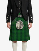 Person wearing a green kilt with a black jacket on a white background