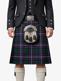 Person wearing a traditional Scottish kilt with a tartan pattern on a white background