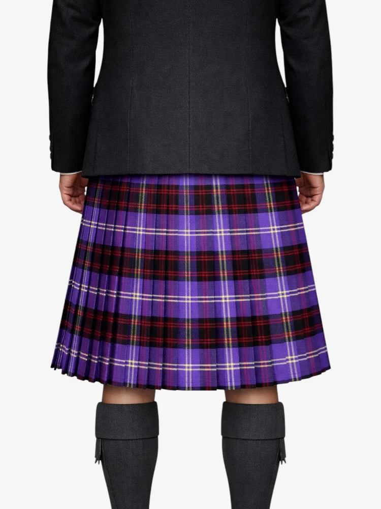 Person wearing a black coat and purple plaid kilt on a white background