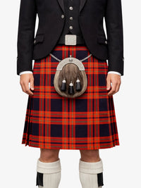Person wearing a black jacket, red plaid kilt, and white knee-high socks on a white background