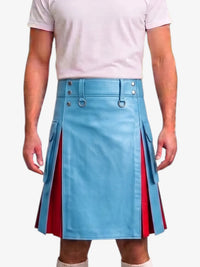 A model wearing a light blue faux leather kilt with red pleated side panels and silver metal hardware, paired with a light pink t-shirt.