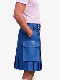 A person wearing a bright blue pleated faux-leather kilt with a matching belt and silver-tone buckle, paired with a light pink t-shirt, shown from the waist down against a plain white background.