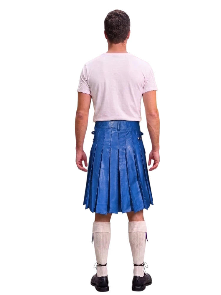 A man shown from the back wearing a blue leather kilt, a light pink t-shirt, cream knee-high socks, and black shoes, isolated on a white background.