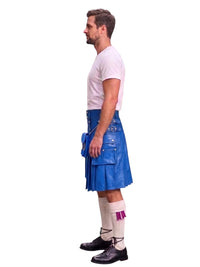 A man shown in profile wearing a blue leather kilt, a white t-shirt, white socks, and black shoes, standing against a solid white background.