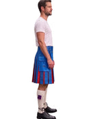 A man shown in profile wearing a blue and red kilt, a white t-shirt, white socks, and black shoes against a plain white background.