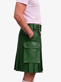 A person wearing a green faux-leather kilt with pleated detailing, a belt, and a large front flap pocket, paired with a light pink t-shirt against a plain white background.