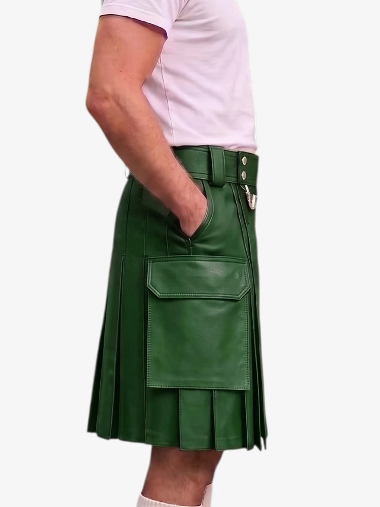 A person wearing a green faux-leather kilt with pleated detailing, a belt, and a large front flap pocket, paired with a light pink t-shirt against a plain white background.