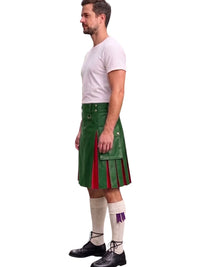 A man shown in profile wearing a green kilt with red pleated side panels, a white t-shirt, white knee-high socks, and black shoes, against a plain white background.