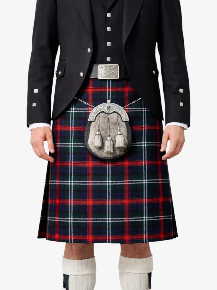 Person wearing a traditional Scottish kilt with a tartan pattern on a white background