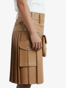 Tan leather skirt with a front pocket on a white background