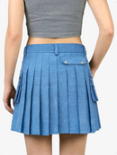 Blue pleated skirt worn by a person on a white background