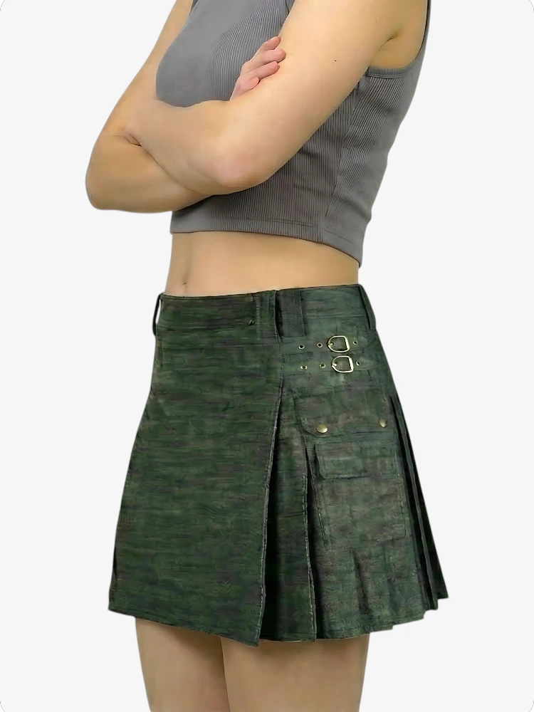 Green pleated skirt worn by a person on a white background