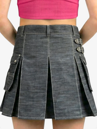 Gray denim skirt with silver buttons worn by a person against a white background