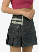 Black denim kilt with silver buckles worn by a person on a white background