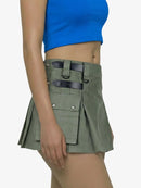 Green tactical skirt with black straps worn by a person on a white background