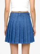 Blue pleated skirt worn by a person on a white background
