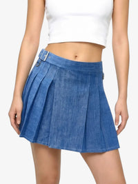 Blue denim skirt worn by a person on a white background