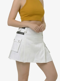 Person wearing a white skirt with a yellow top on a light gray background