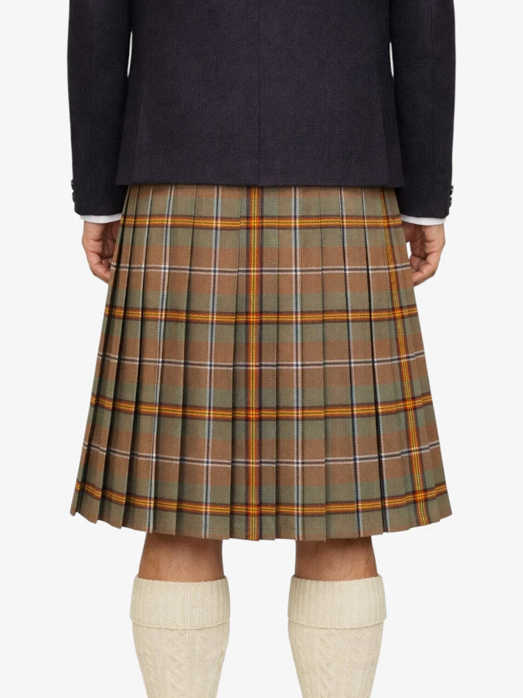 Plaid kilt worn by a person on a white background